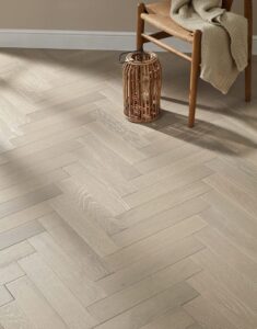 Elegant herringbone flooring installation in a Dubai modern living room